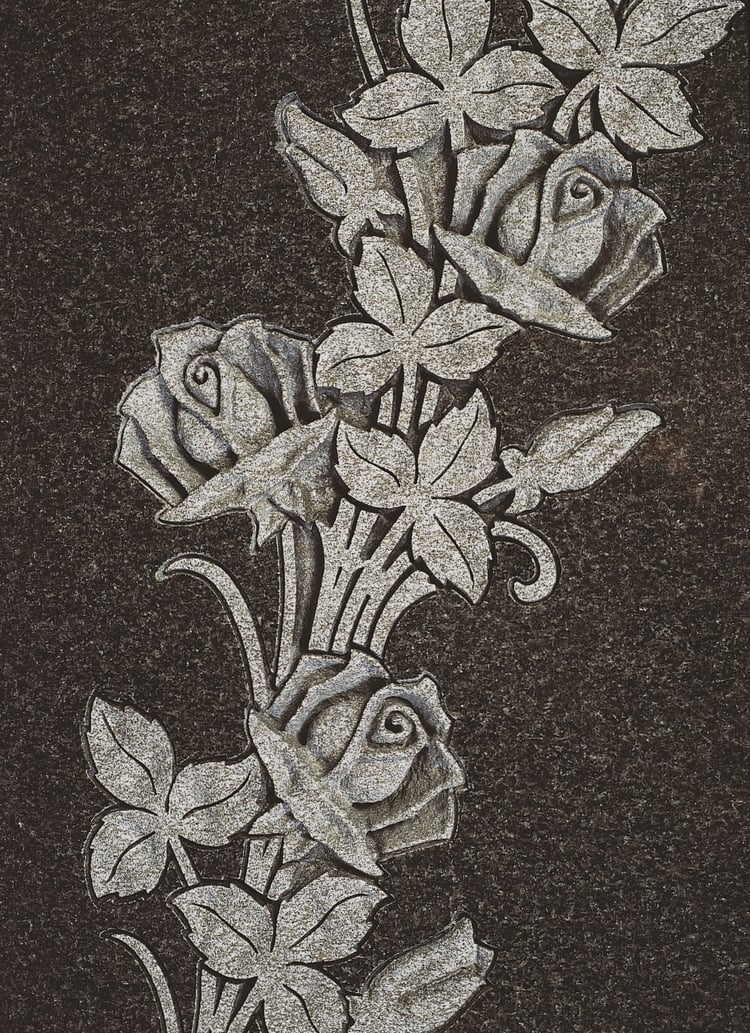 Intricately carved roses in MIDNIGHT BLACK™ granite