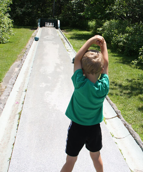 Child bowling on E.L. Smith quarry tour in Barre Vermont