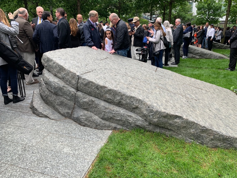 Visitors to the glade 911 memorial NYC Rock of Ages boulders 3-1