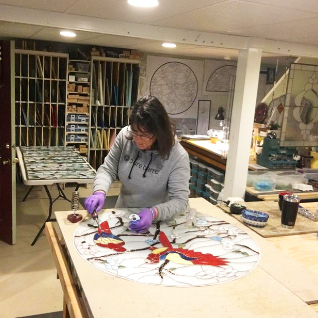 Sue Bee Glass works on a custom stained glass piece for a client
