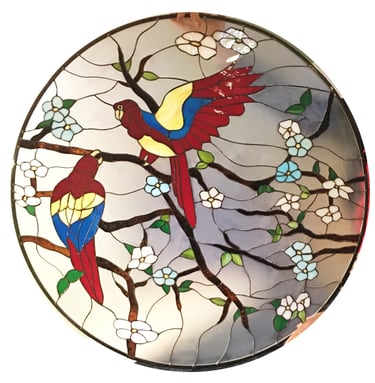 Custom stained glass art of parakeets made by Sue Bee Glass is a personal element that the client wished to add to their family mausoleum 