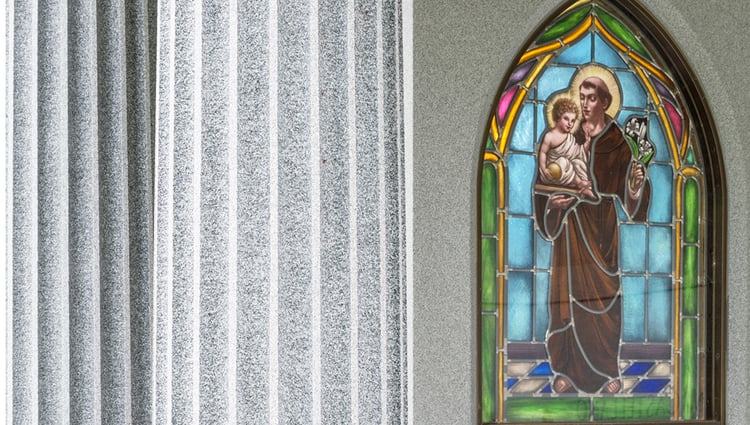 Religious stained glass design in private family mausoleum