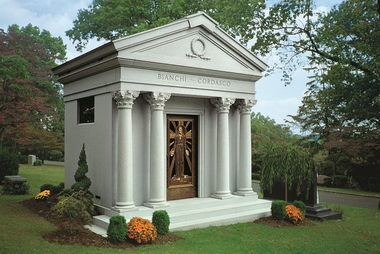 Composite columns on private family mausoleum in cemetery