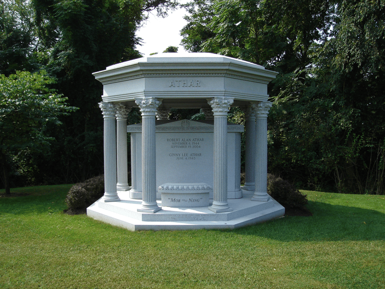 Column's sculptural decorative details on an open air family mausoleum