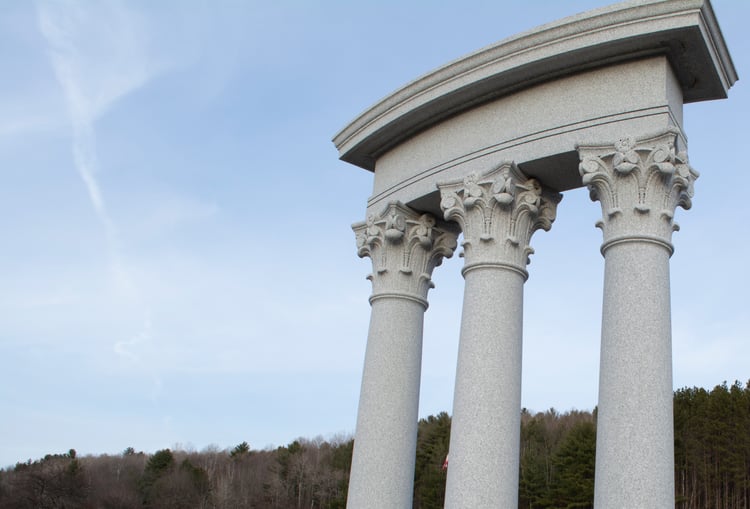 Decorative detailing of Corinthian columns constructed from Blue Gray granite from Rock of Ages