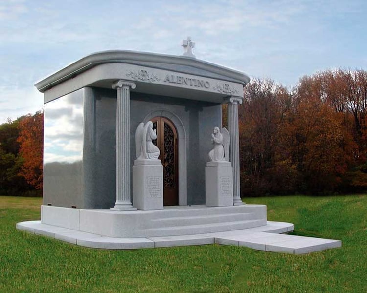 Small Ionic columns on private family mausoleum are spiral and scroll shaped