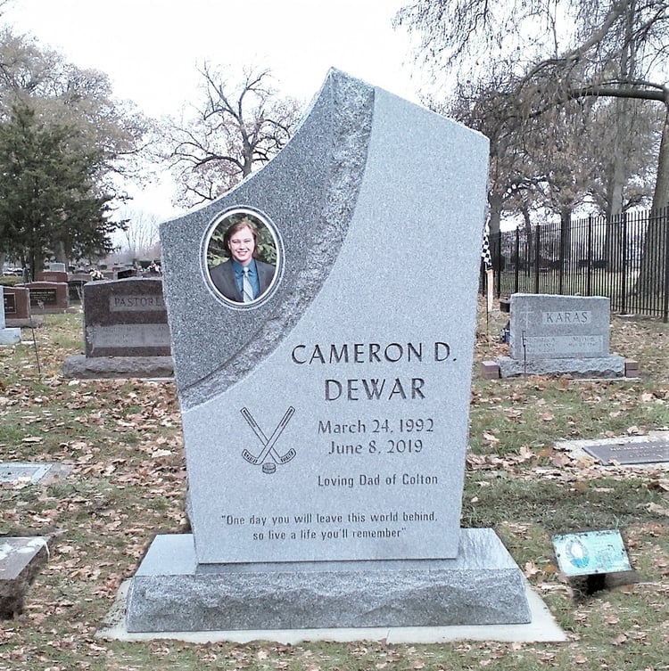 Headstone memorial carved from Blue Gray granite with chiseled edges and photo