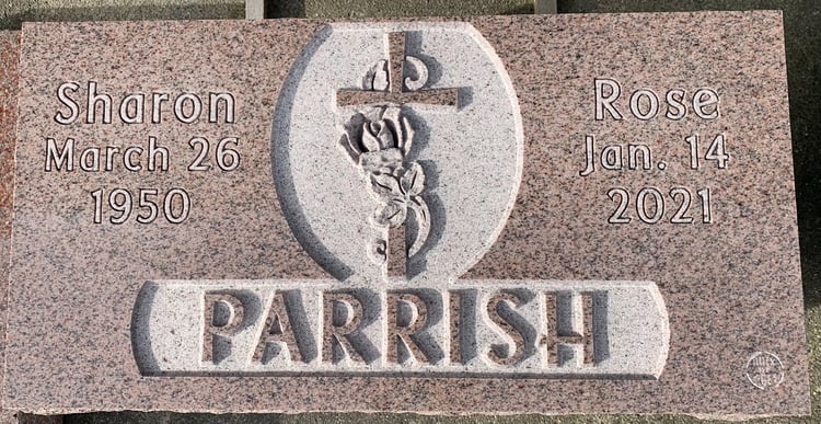 Laurentian Rose granite memorial marker with christian cross details makes a feminine yet classy design