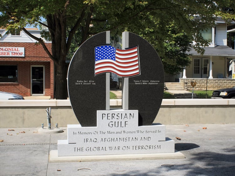 Persian Gulf stone memorial carved and sculpted out of Midnight Black and Blue Gray granite with bronze American Flag detail